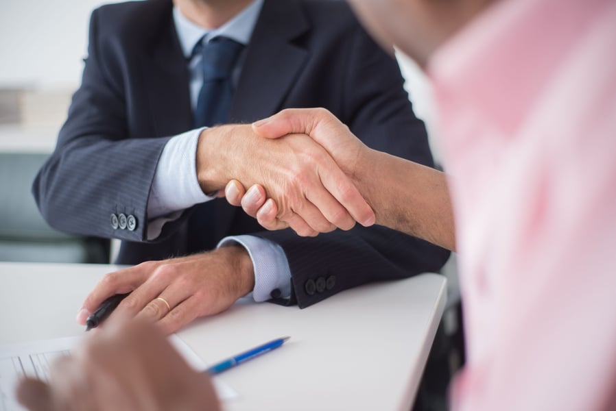 Close up of two people shaking hands