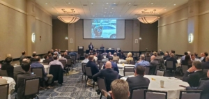 Praveen speaking to room of people