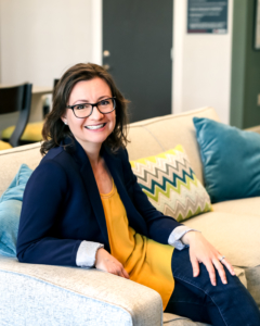 pam marmon sitting on couch