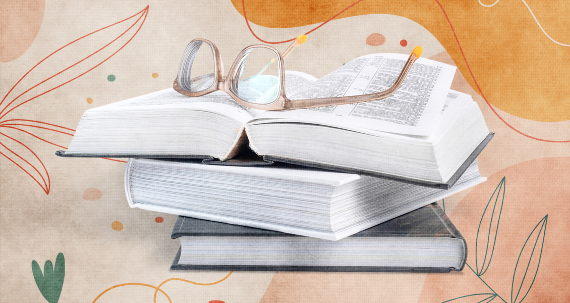 stack of books with glasses on top