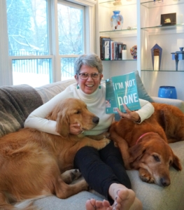 Patti with dogs and book