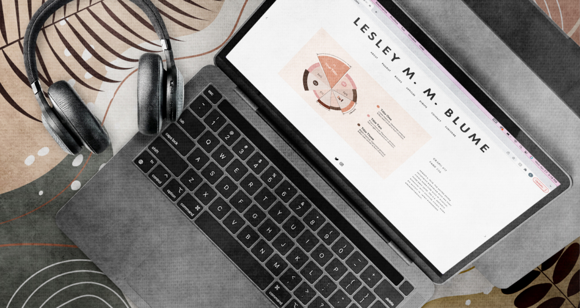 headphones next to laptop with chart and images displayed on screen