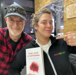 Pavel with reader holding book