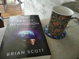 table with book and coffee mug