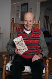 charles daly with his book