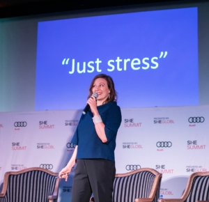 Valerie speaking on stage