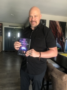 brian scott posing with book