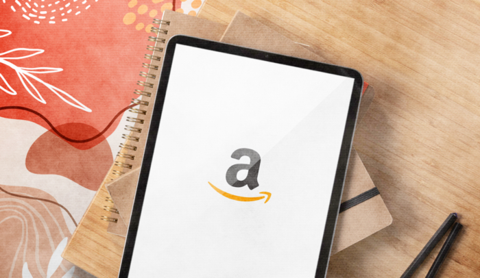 feature image amazon logo on tablet on stack of books