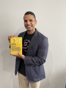 author posing with published book