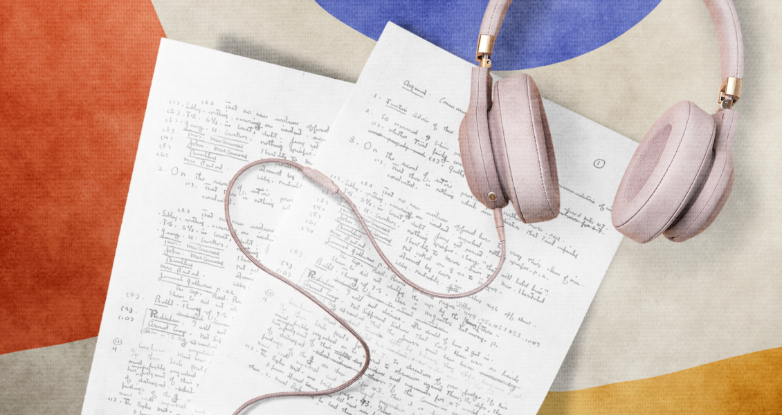 notes on paper with a pair of headphones